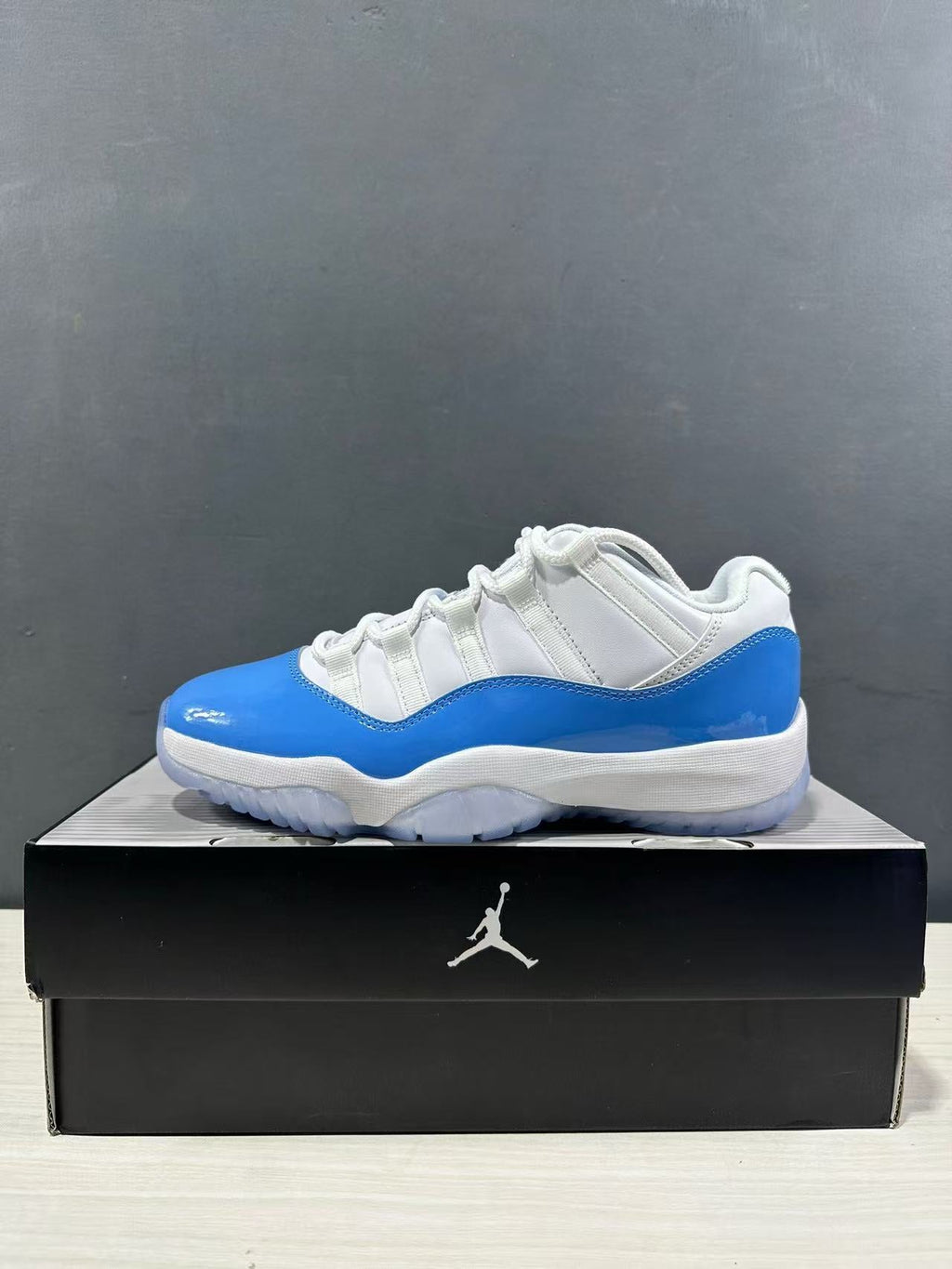 Air Jordan 11 Retro Low UNC Blue Sneakers FV5104-100 - product image from the listing.