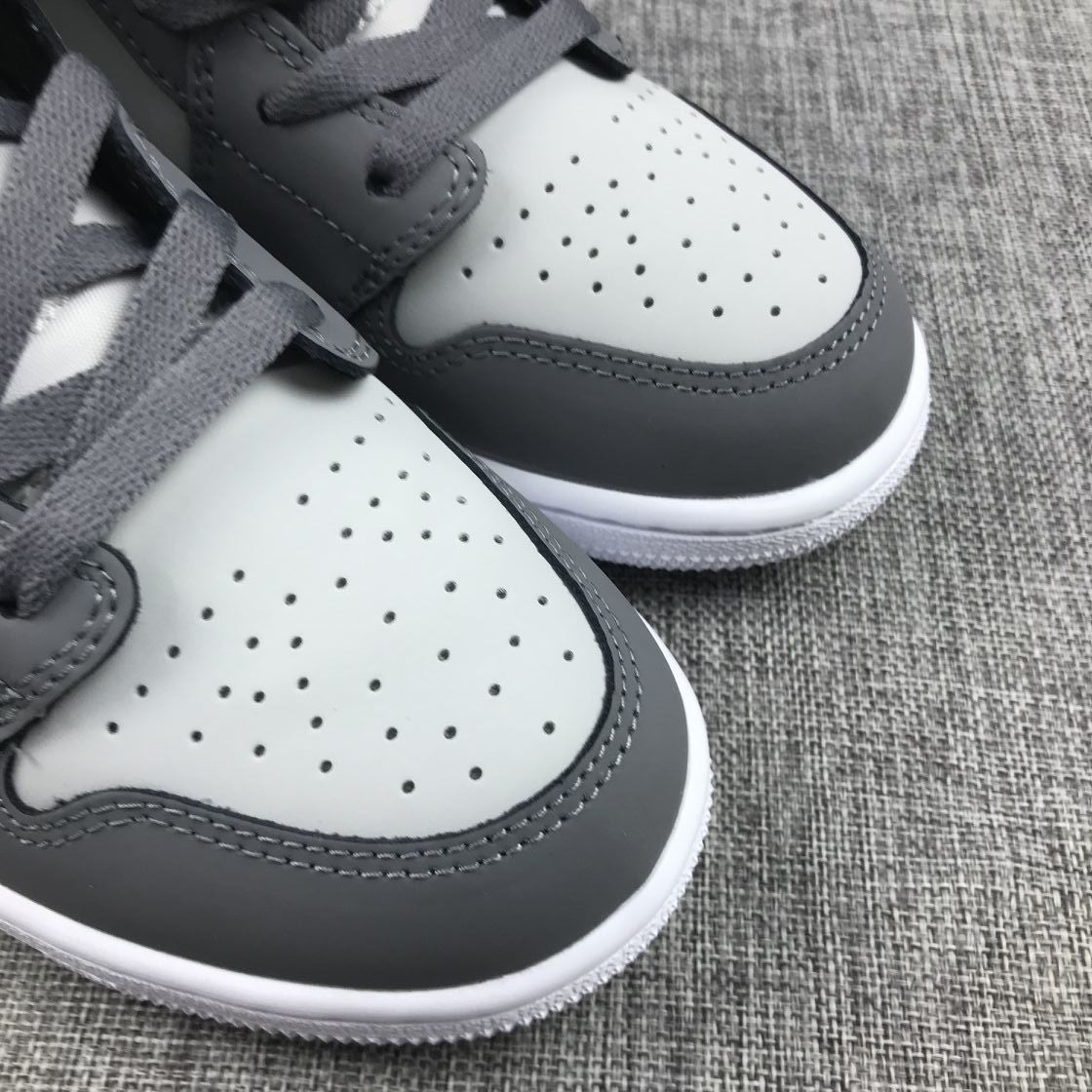 Air Jordan 1 Mid Sneakers in Grey Volt 554724-072 - product image from the listing.