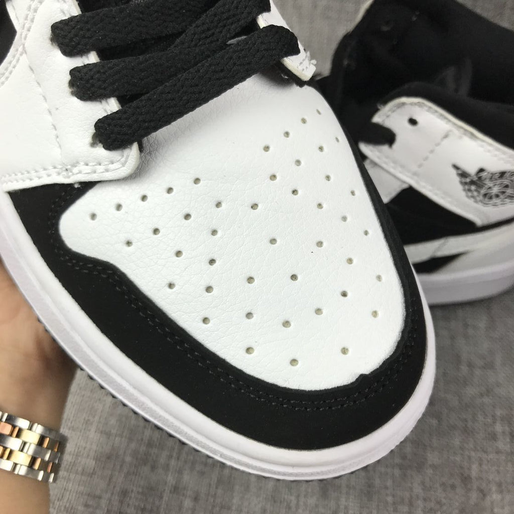 Air Jordan 1 Mid Black White Sneakers 554724-113 - product image from the listing.