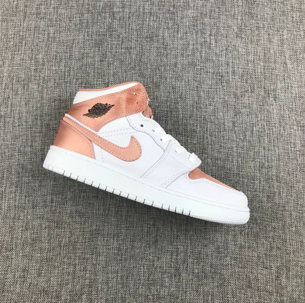 Women's Jordan 1 Mid Rose Gold Silk Sneakers 555112-190 - product image from the listing.