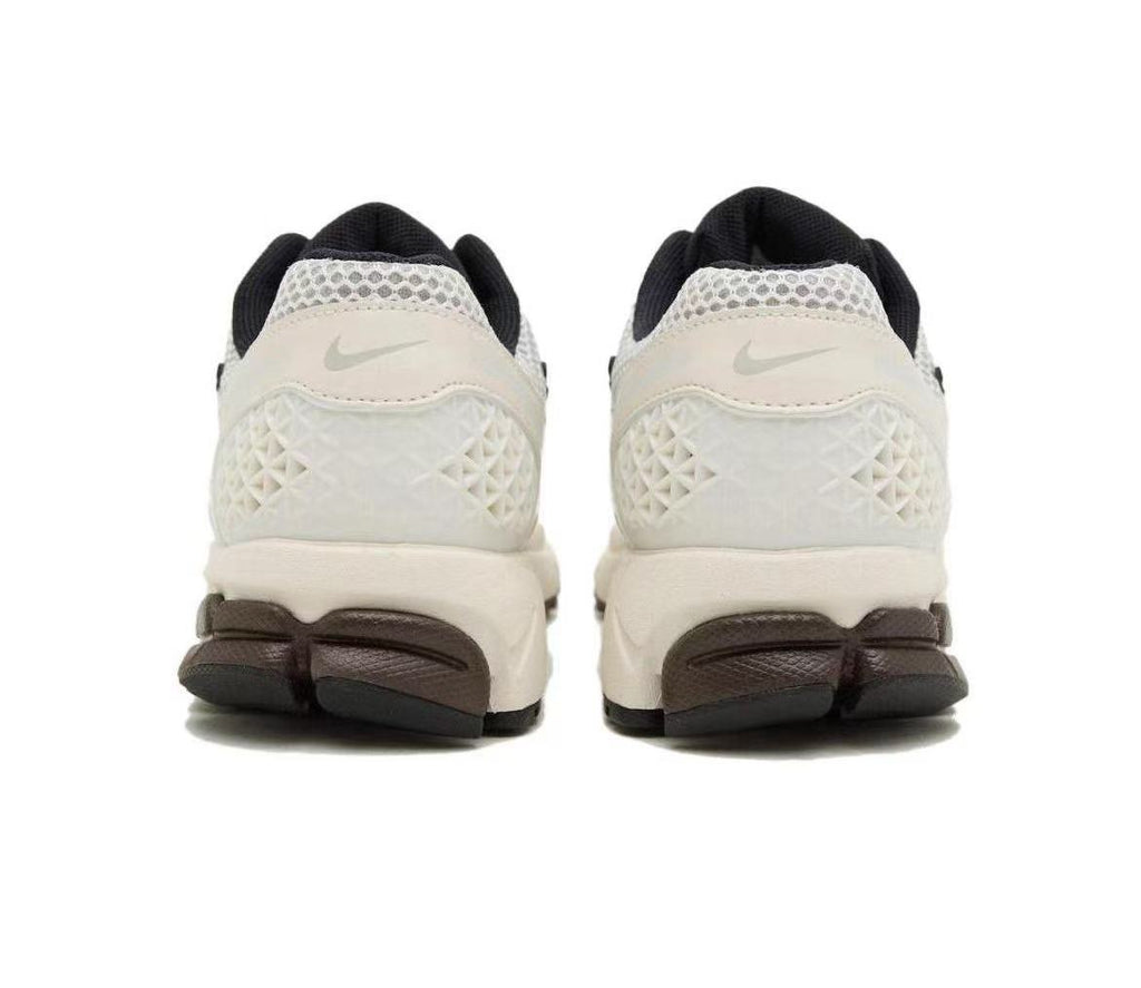 Metallic Silver and White Nike Vomero 5 Sneakers - product image from the listing.