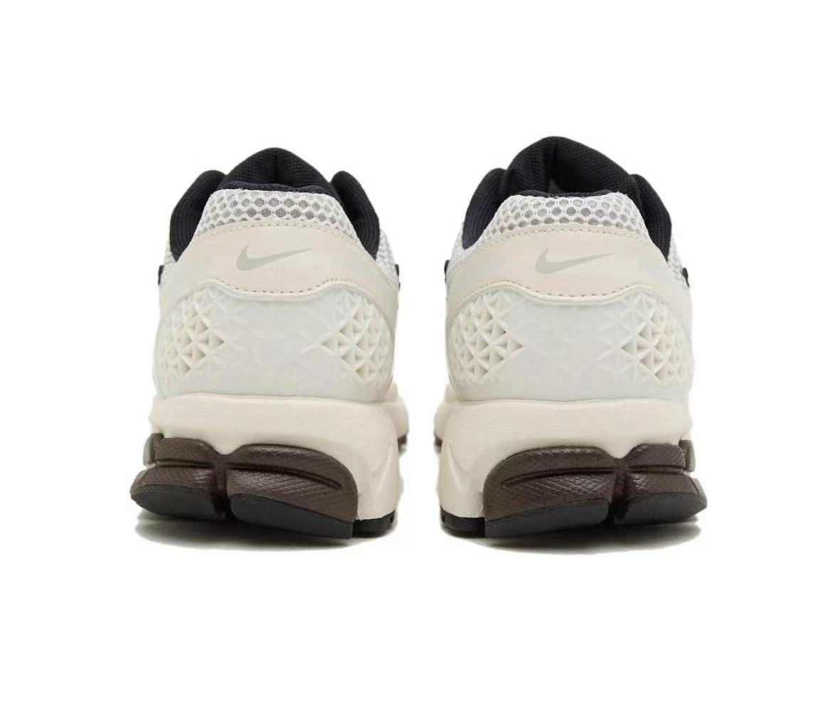 Metallic Silver and White Nike Vomero 5 Sneakers - product image from the listing.