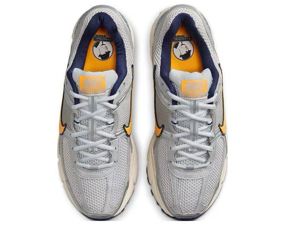 Nike Zoom Vomero 5 Sneakers in Gray Orange - product image from the listing.