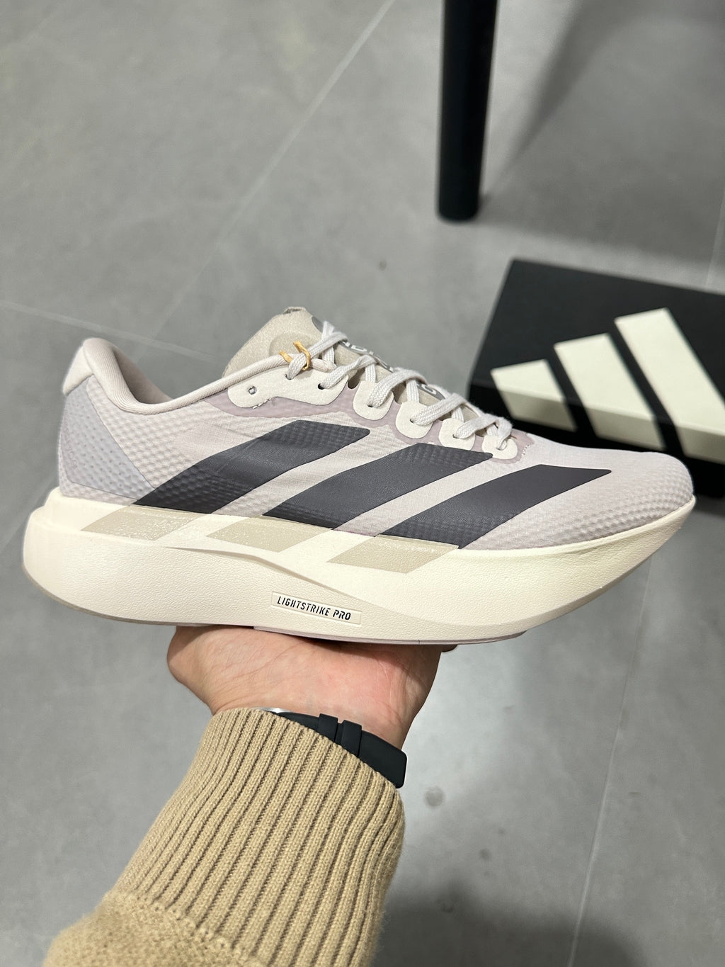 Adidas Lightstrike Pro Running Shoes in White and Gray KJ2001 - product image from the listing.