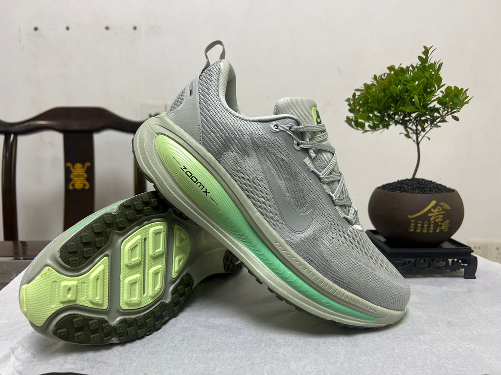 Nike Vomero 18 Running Shoes, in Gray and Volt - product image from the listing.