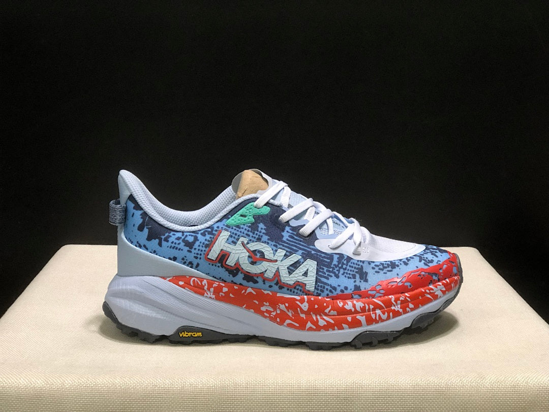 HOKA Speedgoat 6 Trail Running Shoes, in Blue and Orange - product image from the listing.