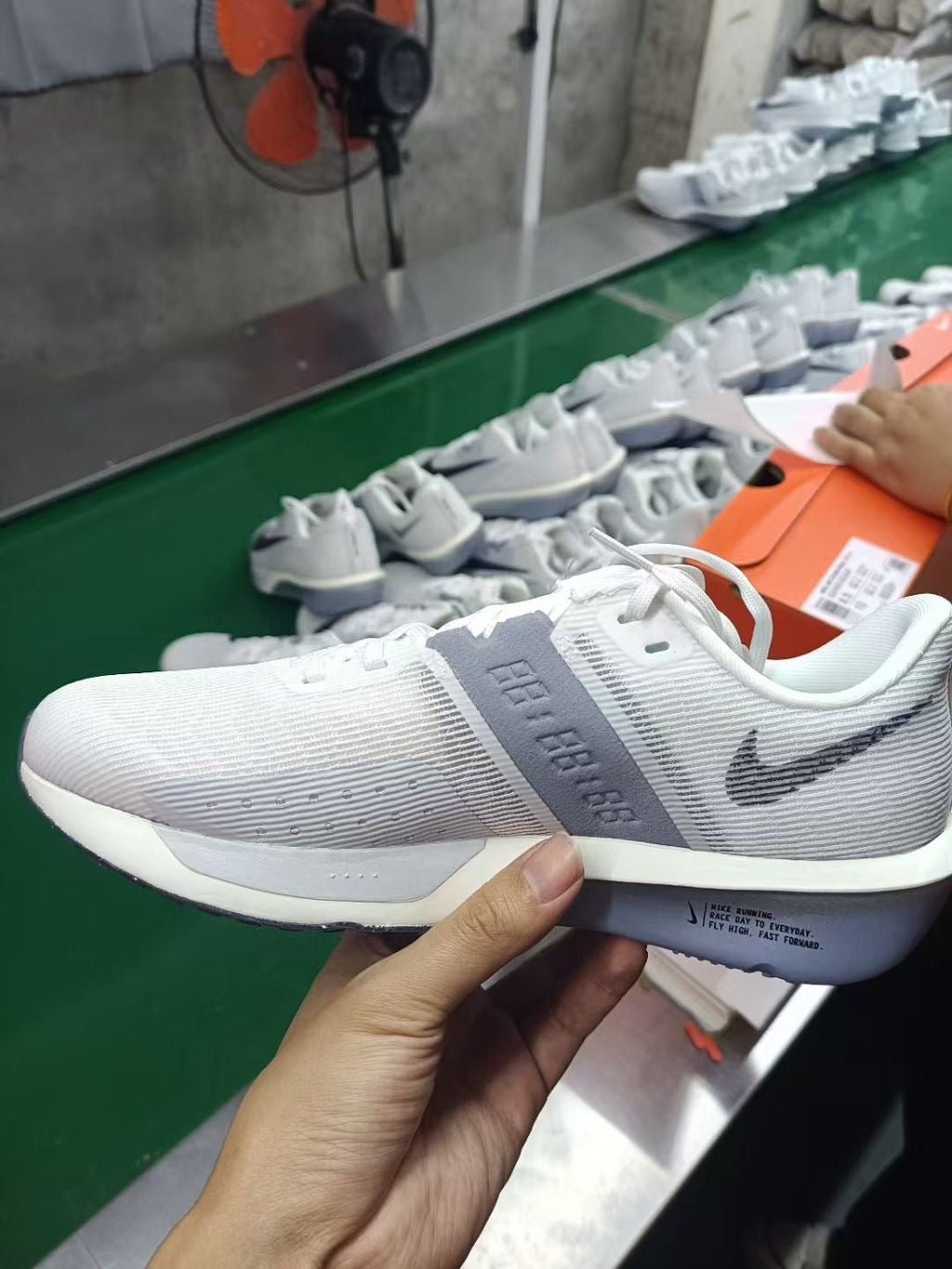 Nike Air Zoom Rival Fly 4 Running Shoes FV6040-102 in Gray White - product image from the listing.