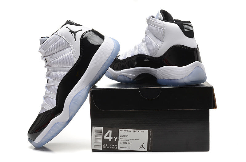 Air Jordan 11 Retro High White and Black Sneakers - product image from the listing.