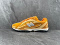 New Balance 204L Sneakers in Yellow and Brown - product image from the listing.
