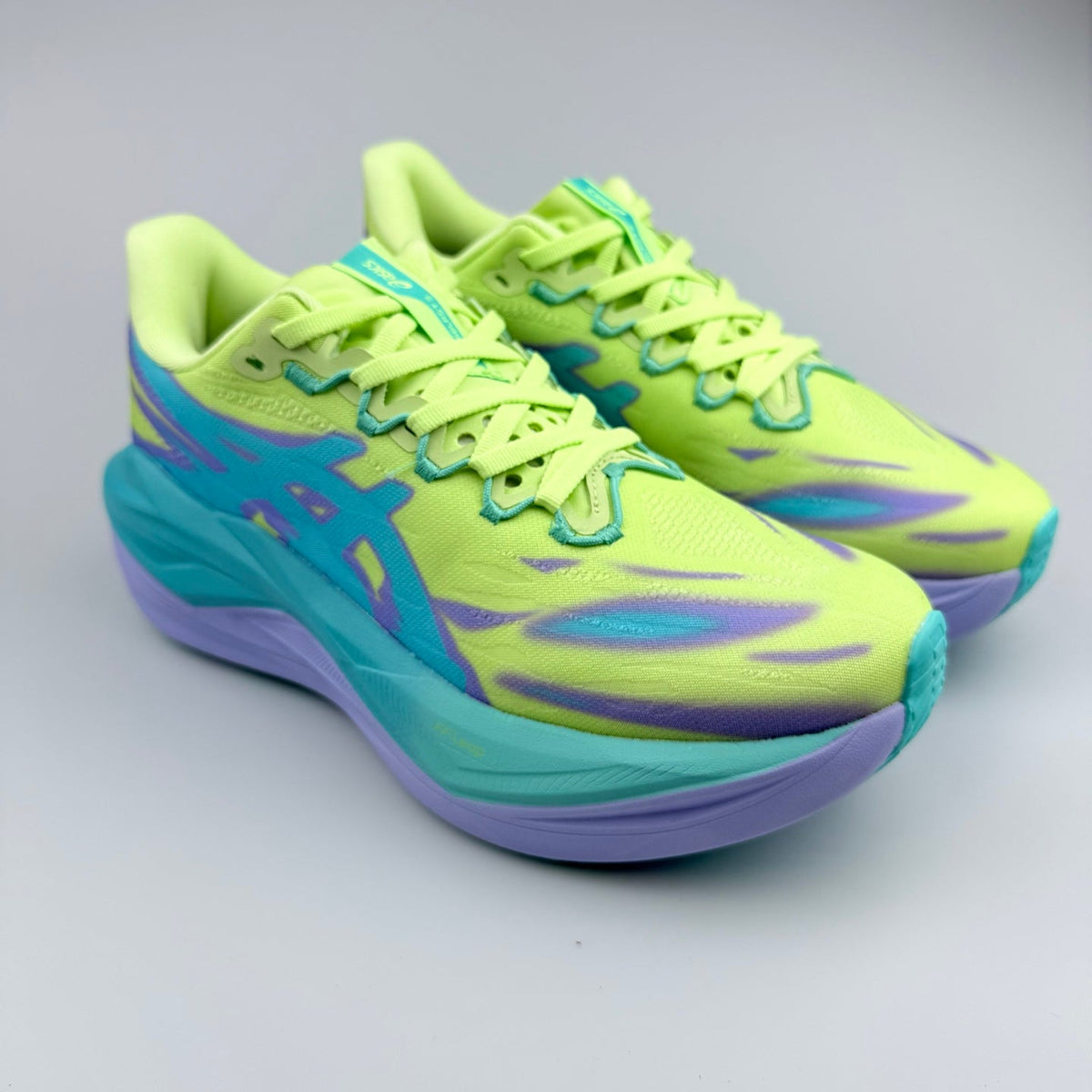 Nike Running Shoes in Volt Green, in Teal and Purple - product image from the listing.