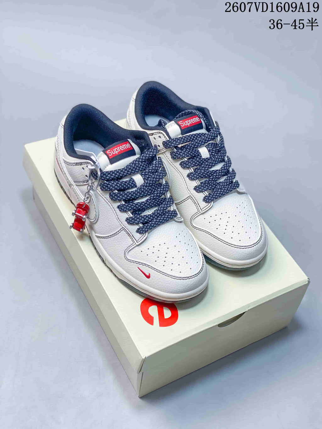 Nike Dunk Low Retro Custom Sneakers in White and Navy - product image from the listing.