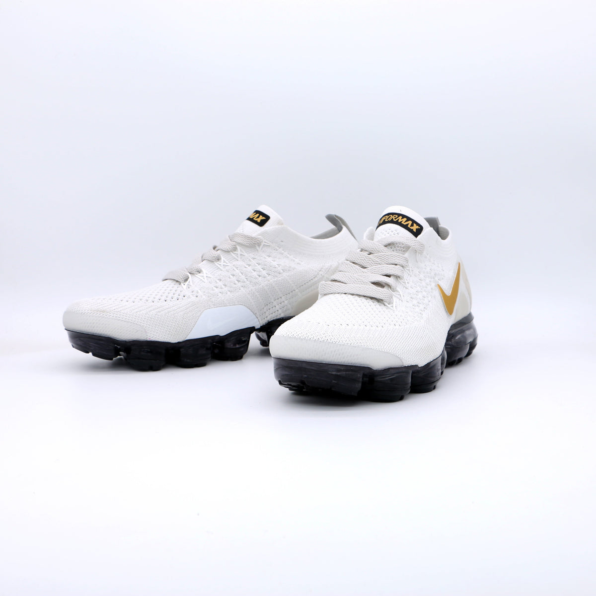 Nike Air VaporMax Flyknit Sneakers in White Gold Black 942842-010 - product image from the listing.