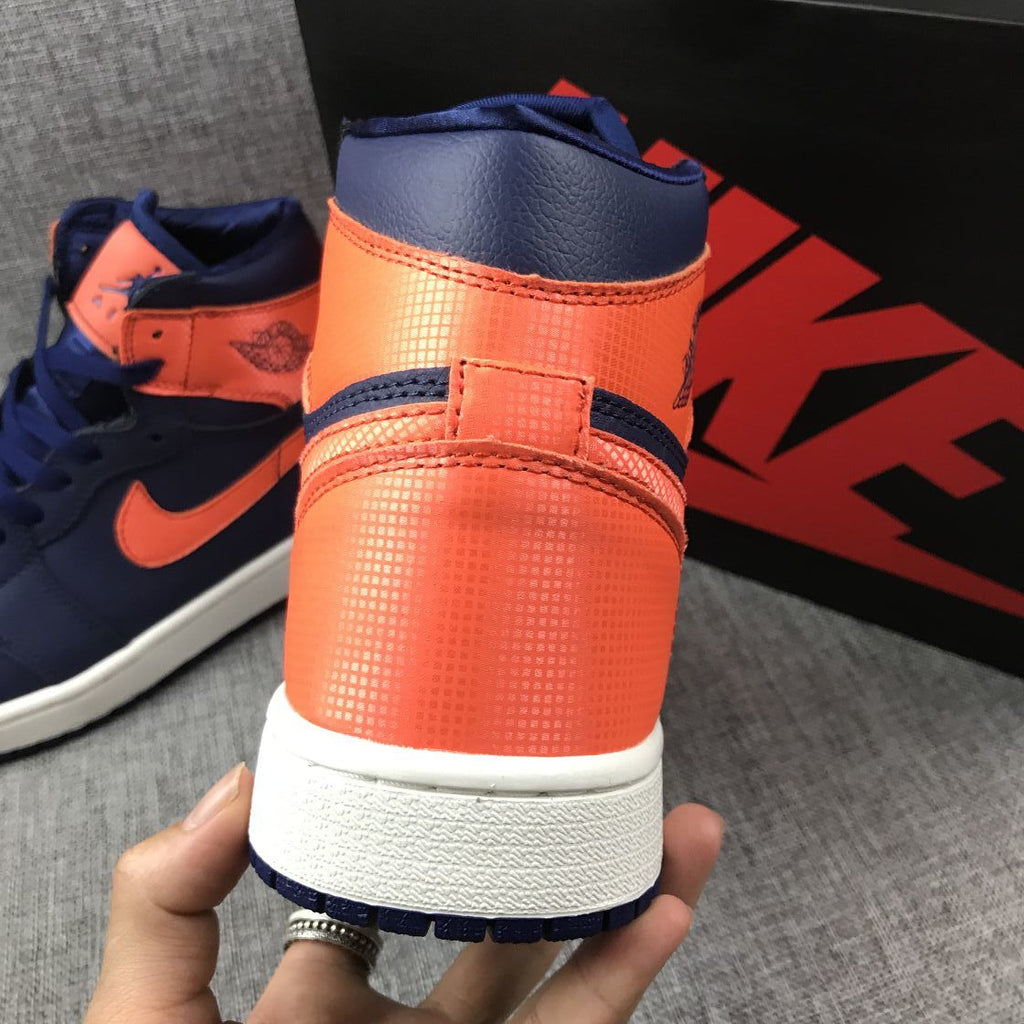 Air Jordan 1 Mid Sneakers in Blue Orange AH7389-408 - product image from the listing.