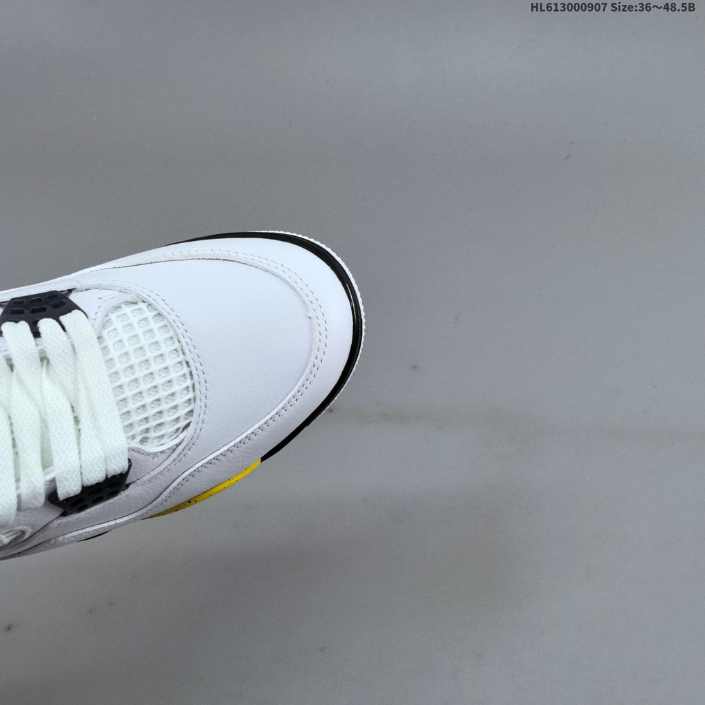 Air Jordan 4 Retro White Yellow Black Sneakers - product image from the listing.