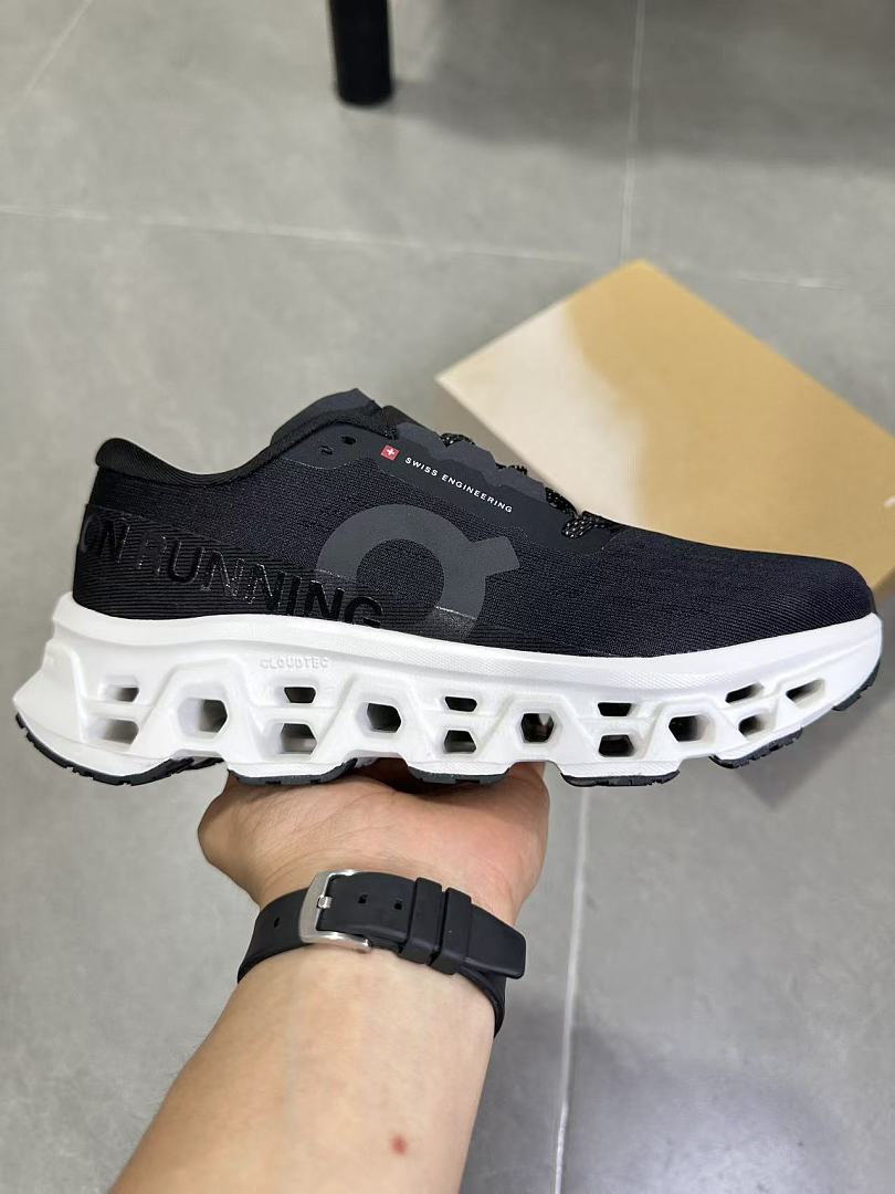 On Running Black and White Road Sneakers for Running - product image from the listing.