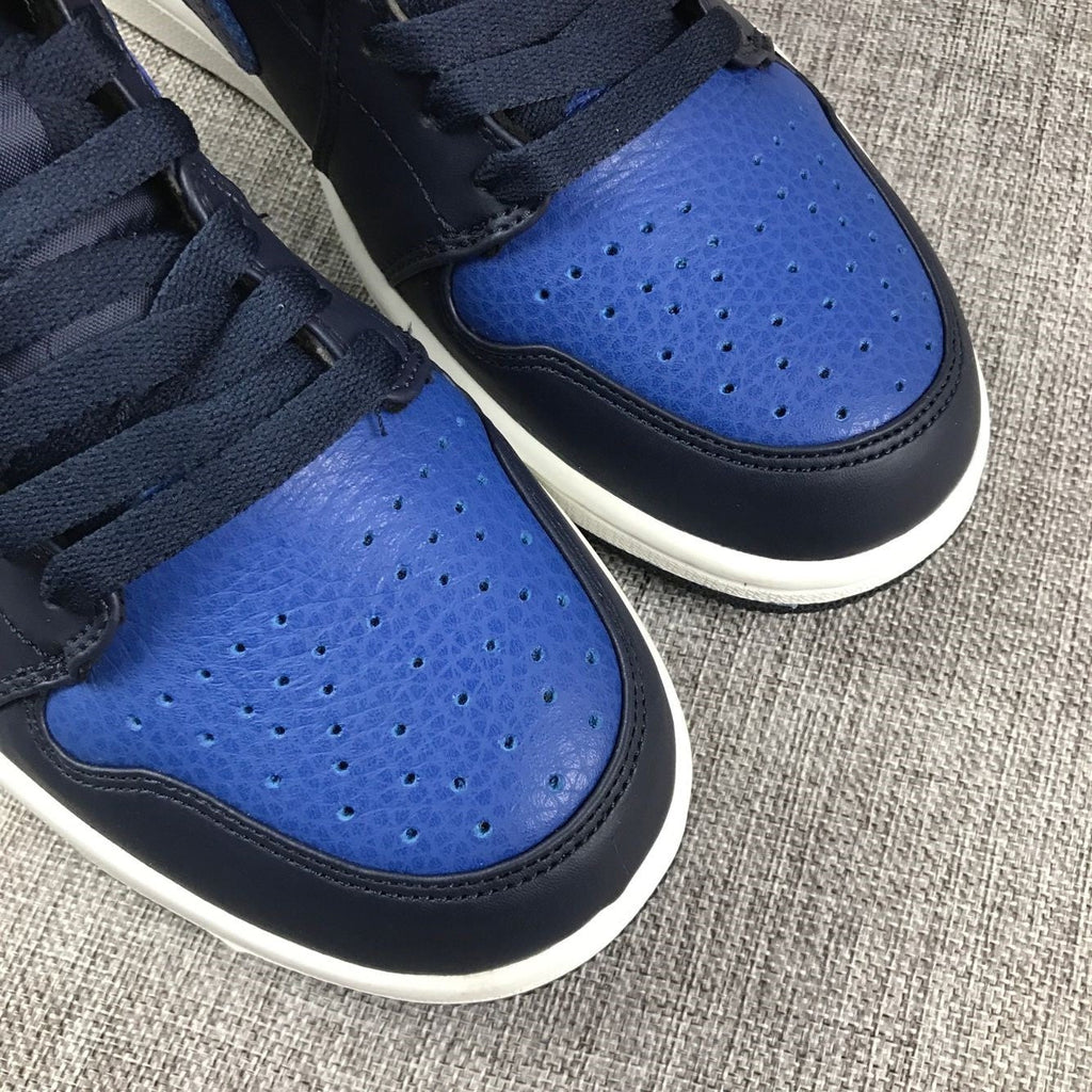Air Jordan 1 Mid High-Top Sneakers in Black and Royal Blue - product image from the listing.