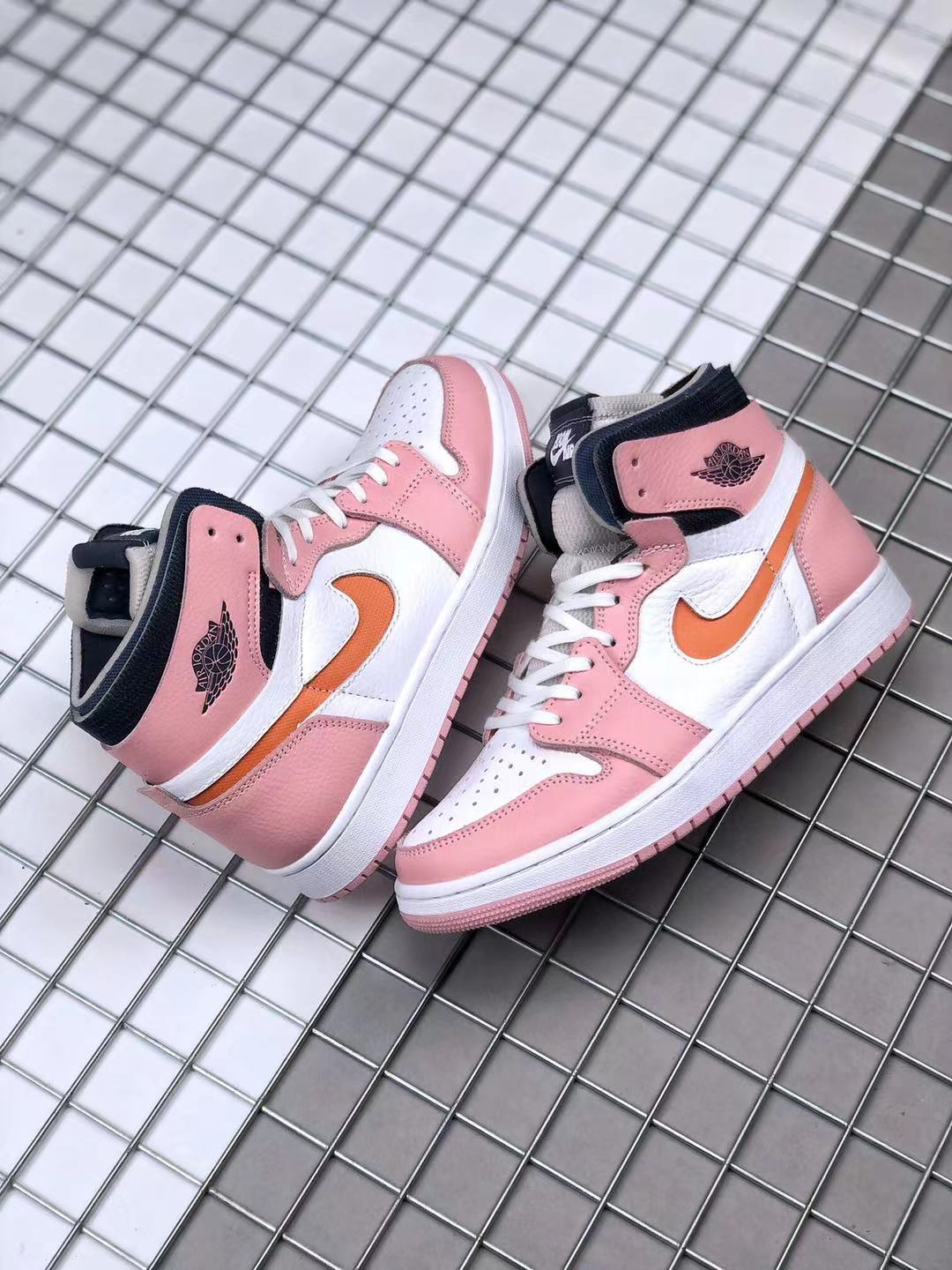 Jordan 1 High Zoom CMFT Sneakers in Pink White Orange CT0979-601 - product image from the listing.