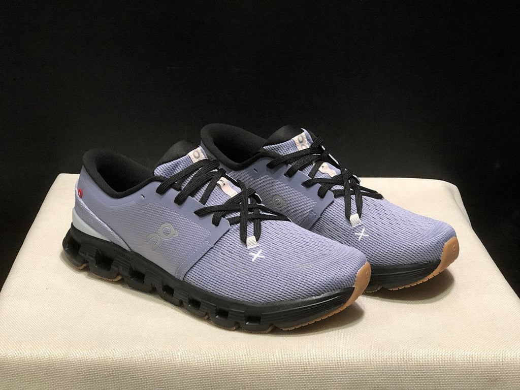On Cloud X 4 Sneakers in Feather in Black - product image from the listing.