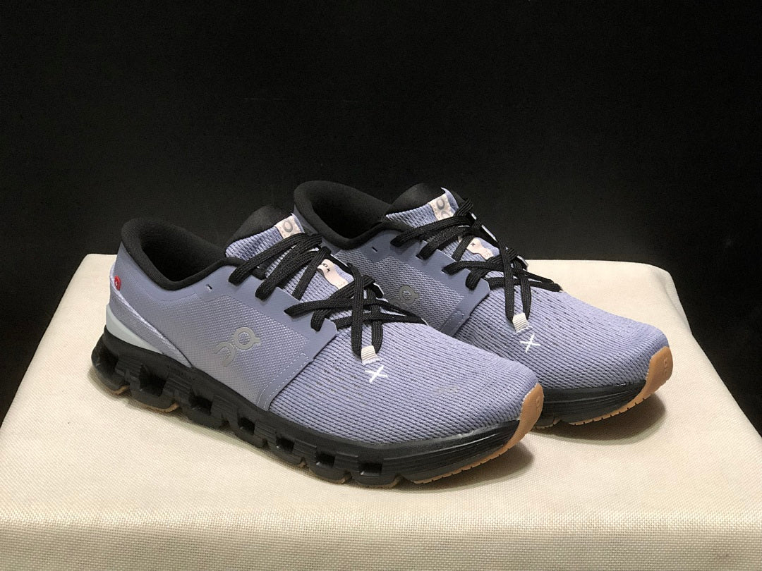 On Cloud X 4 Sneakers in Feather in Black - product image from the listing.