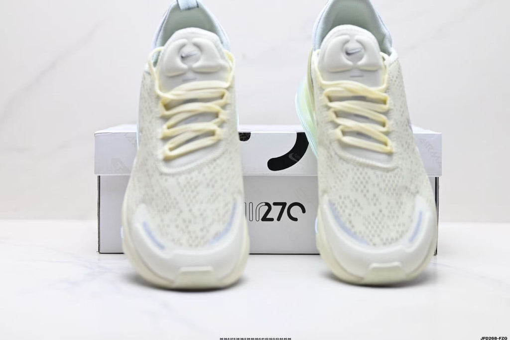 Light Green and White Nike Air Zoom Sneakers - product image from the listing.