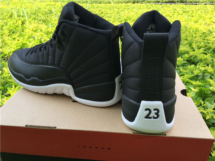 Air Jordan 12 Black Nylon High-Top Sneakers - product image from the listing.