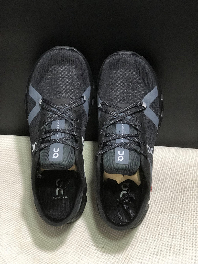 On Cloud X 4 AD Sneakers in Black - product image from the listing.