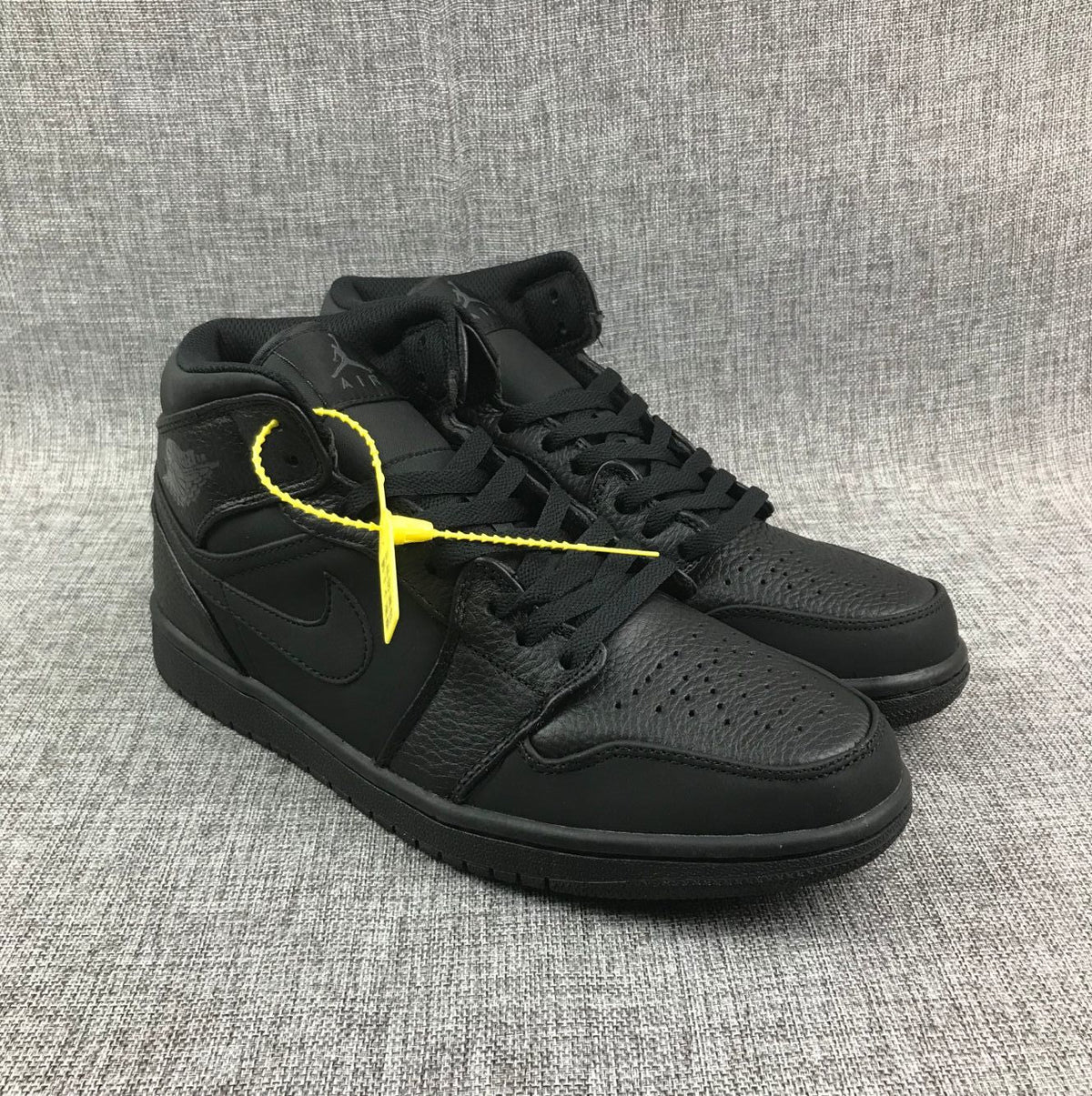 Air Jordan 1 Mid Sneakers, in Black - product image from the listing.