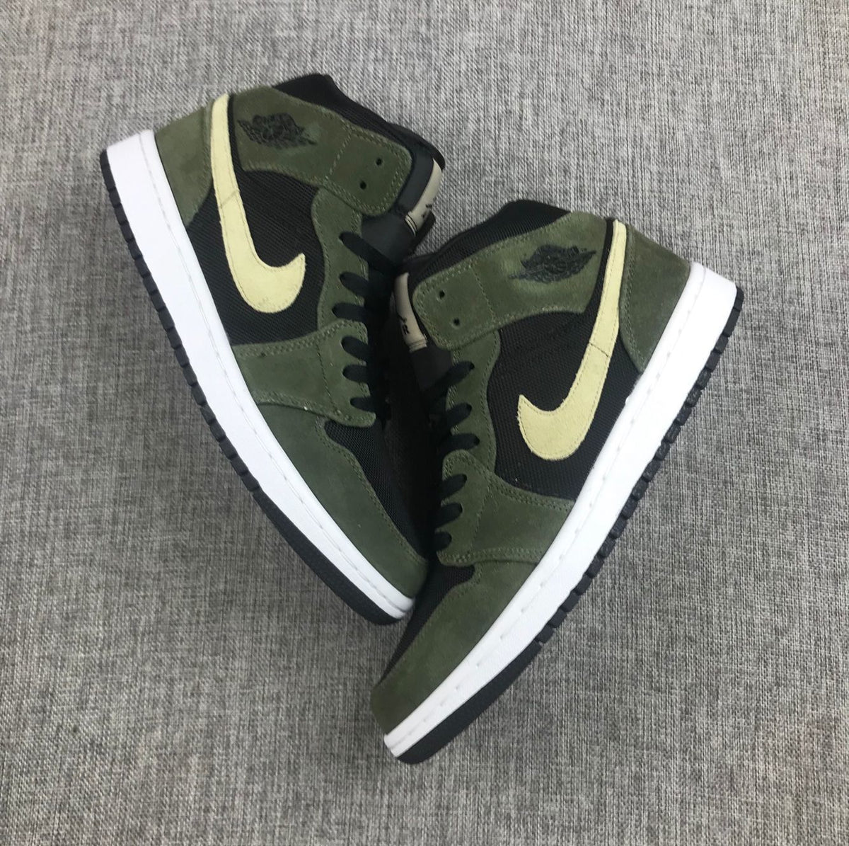Air Jordan 1 Mid Sneakers in Olive Green BQ6472-030 - product image from the listing.