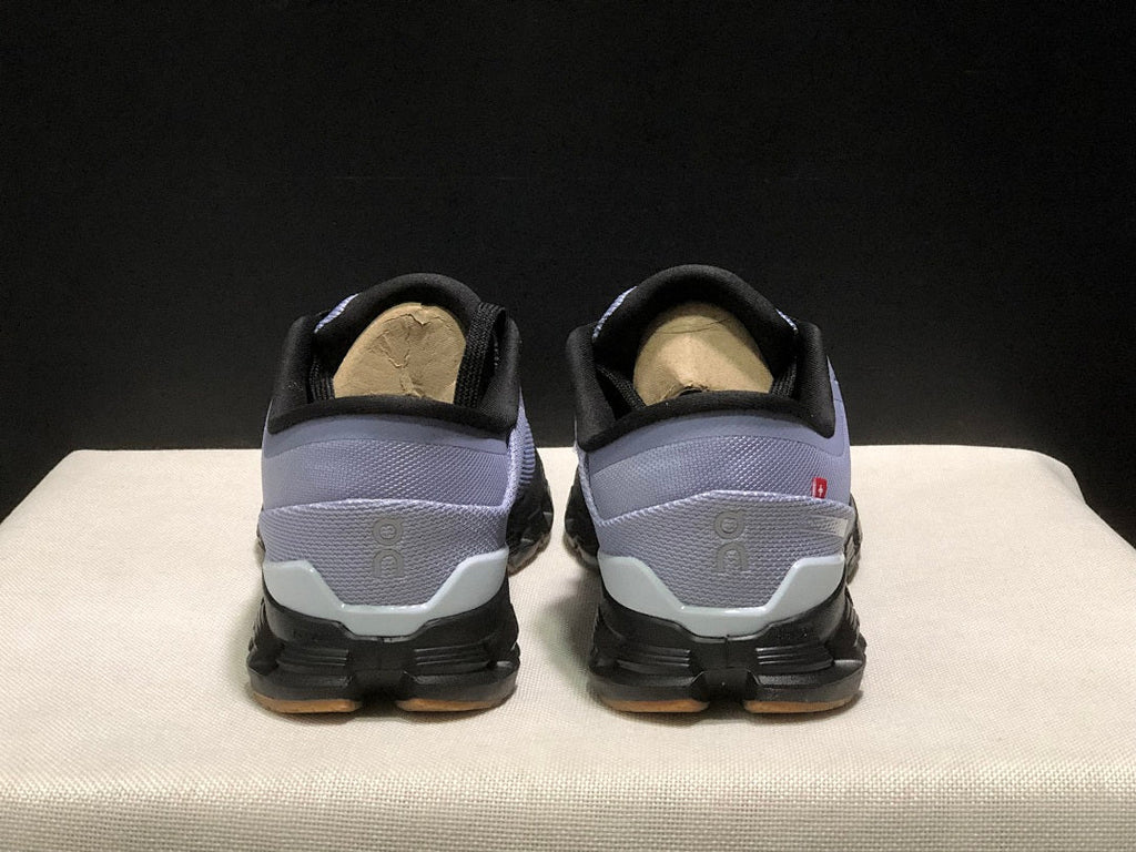 On Cloud X 4 Sneakers in Feather in Black - product image from the listing.