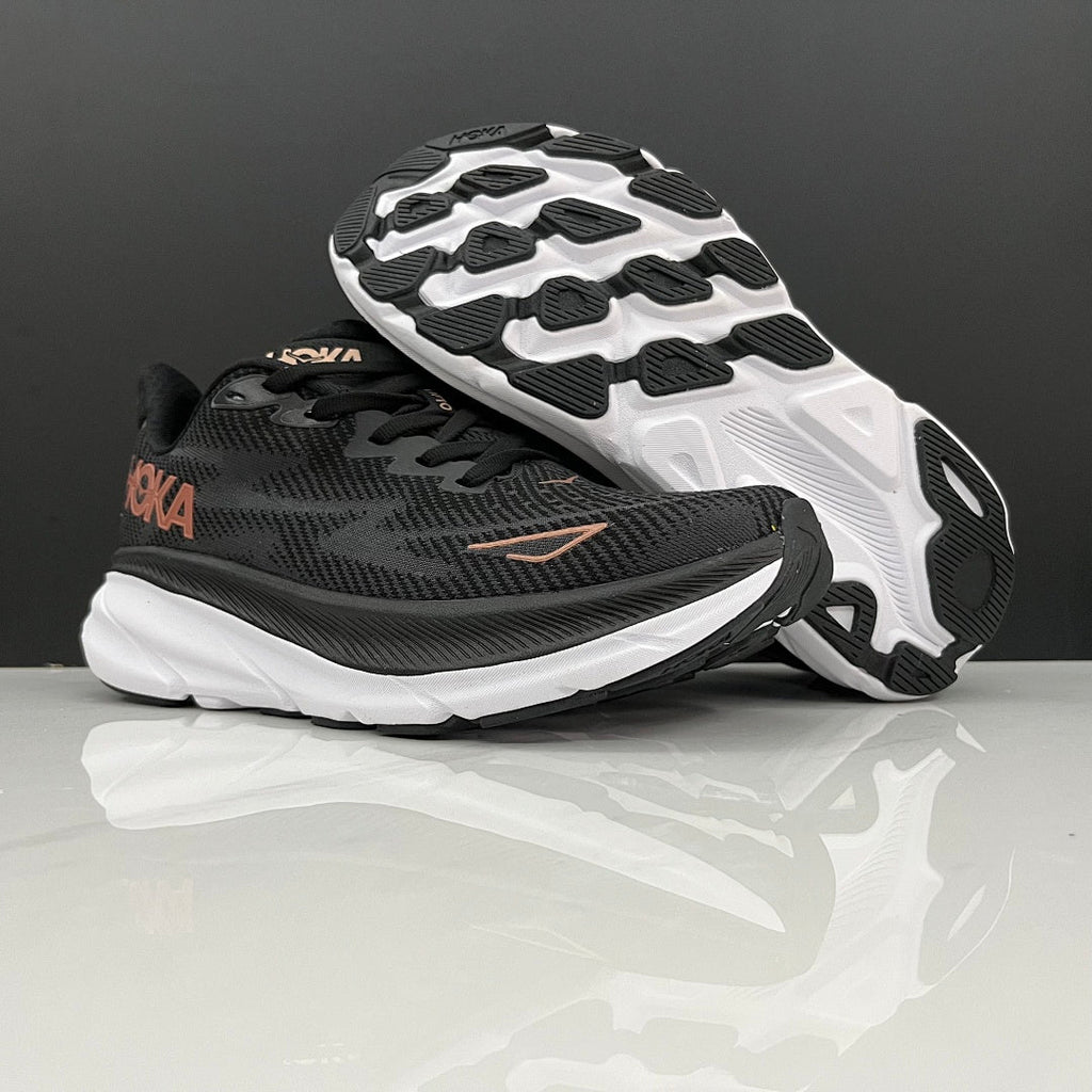 HOKA Clifton 9 Running Shoes in Black and Gold - product image from the listing.