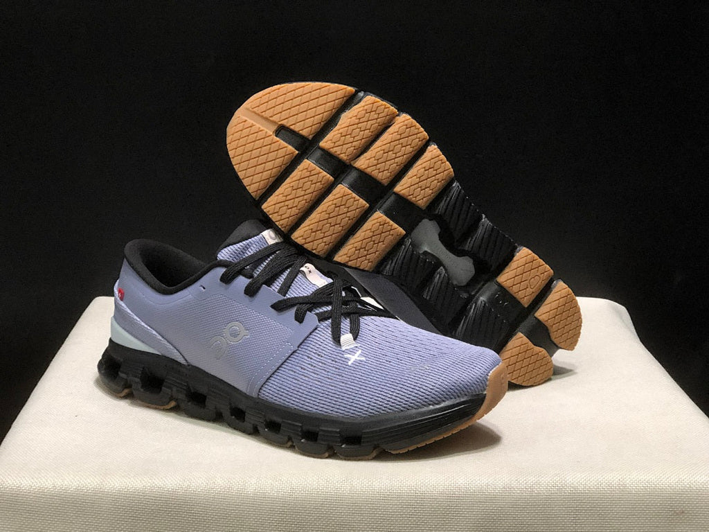 On Cloud X 4 Sneakers in Feather in Black - product image from the listing.