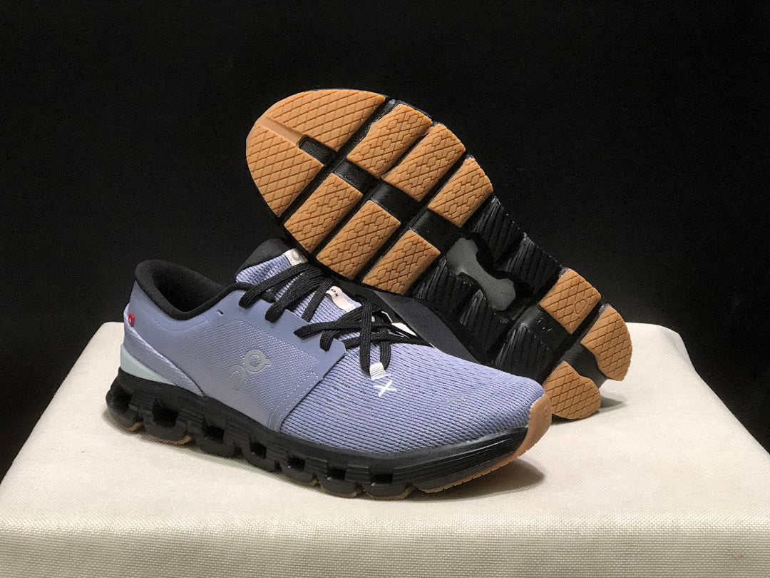 On Cloud X 4 Sneakers in Feather in Black - product image from the listing.
