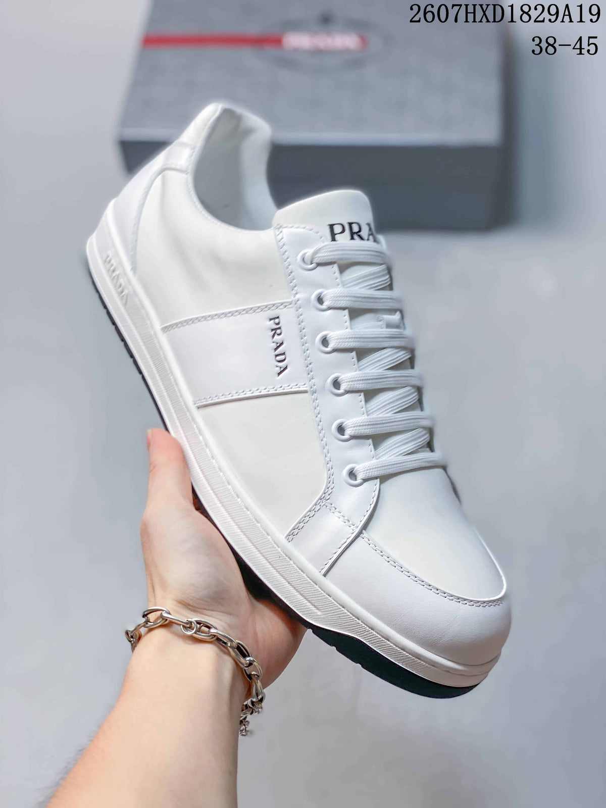 Prada Downtown Low-Top Sneakers in White Leather 2607HXD1829A19 - product image from the listing.