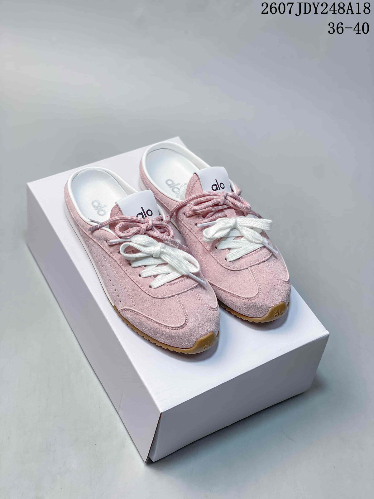 alo Sunset Mule Sneakers in Pink, in Navy and Cream - product image from the listing.