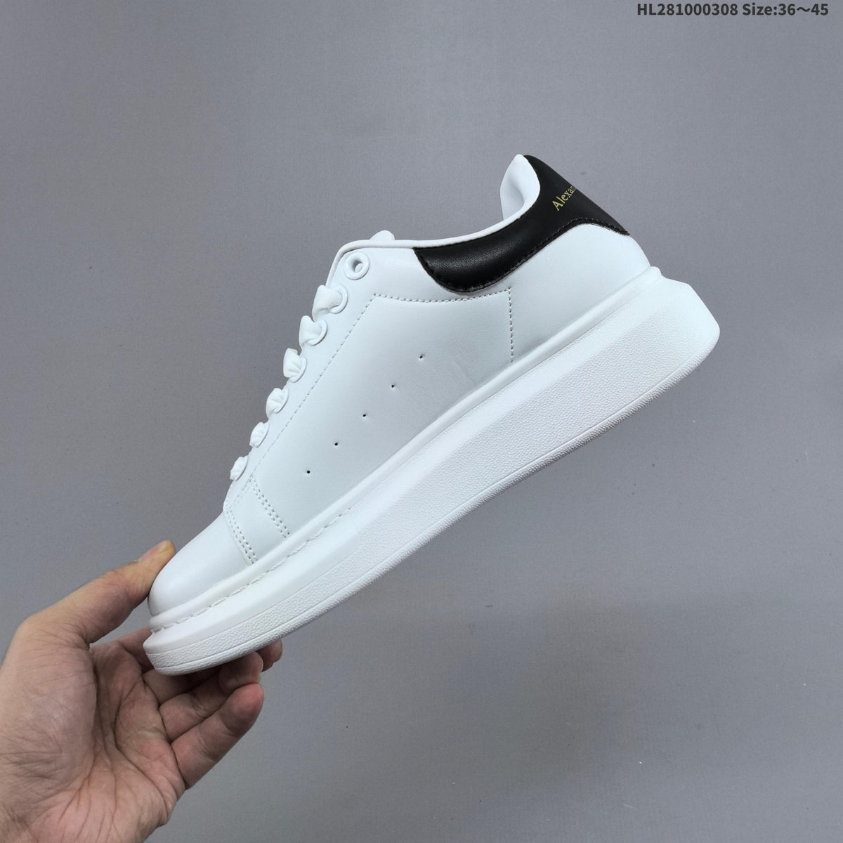 Alexander McQueen Oversized Low-Top Sneakers, in White and Black HL281000308 - product image from the listing.