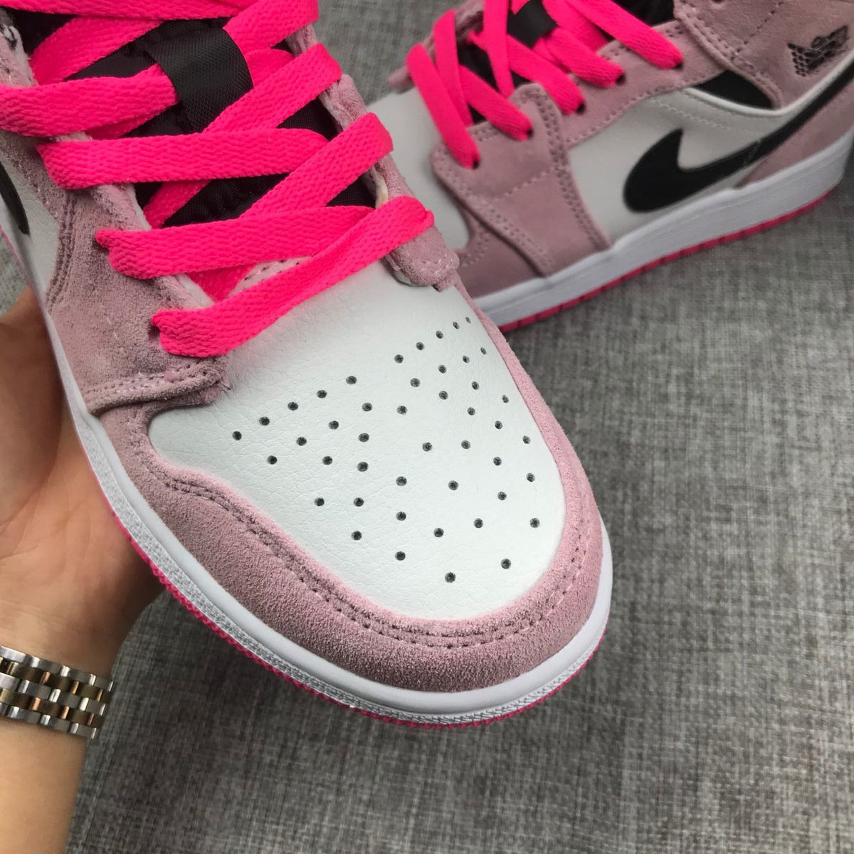 Jordan 1 Mid Sneakers in Pink White Black 852542-801 - product image from the listing.