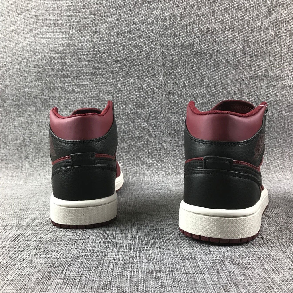 Air Jordan 1 Mid High-Top Sneakers in Burgundy and Black - product image from the listing.