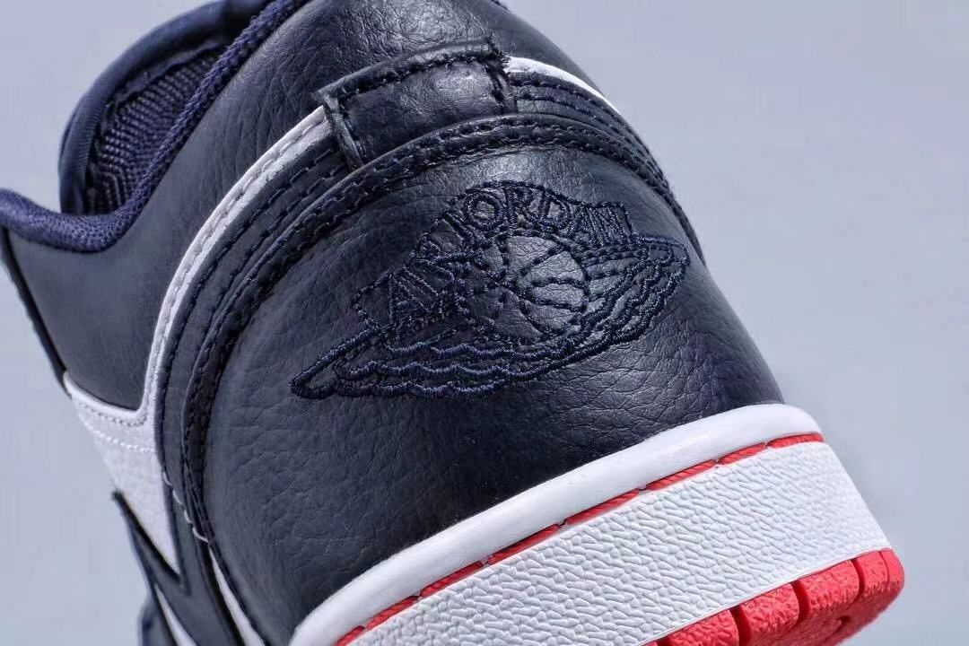 Jordan 1 Low Sneakers in Midnight Navy White Red - product image from the listing.