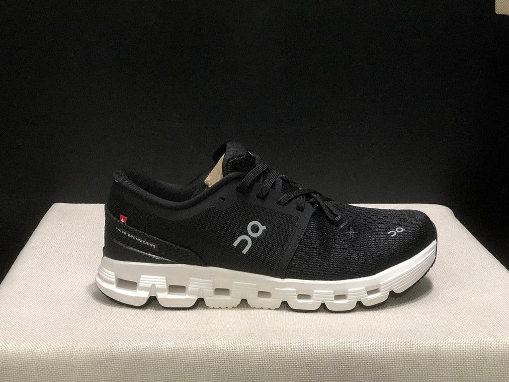 On Cloud X 4 Sneakers in Black and White - product image from the listing.