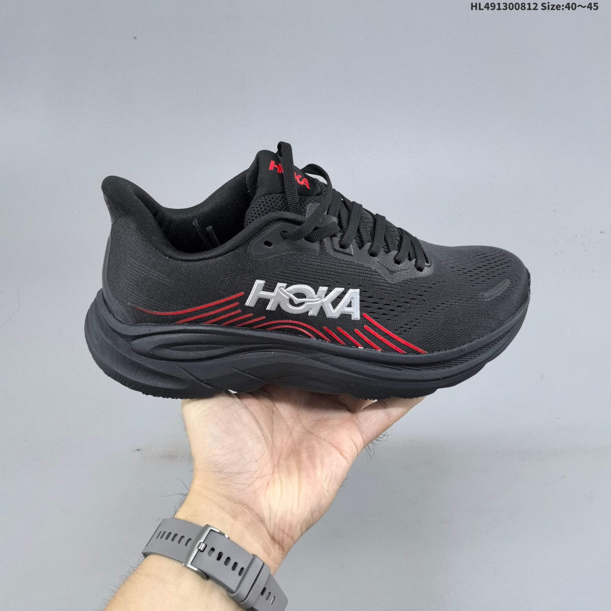 HOKA Clifton 11 Black Shoes for Running with Red Accents - product image from the listing.