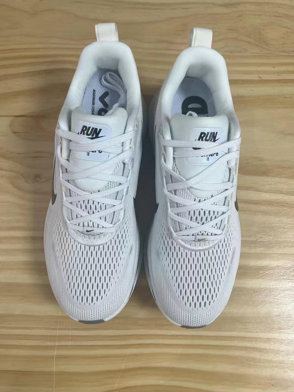 Nike Vomero 18 Shoes for Running, White with Dark Swoosh - product image from the listing.