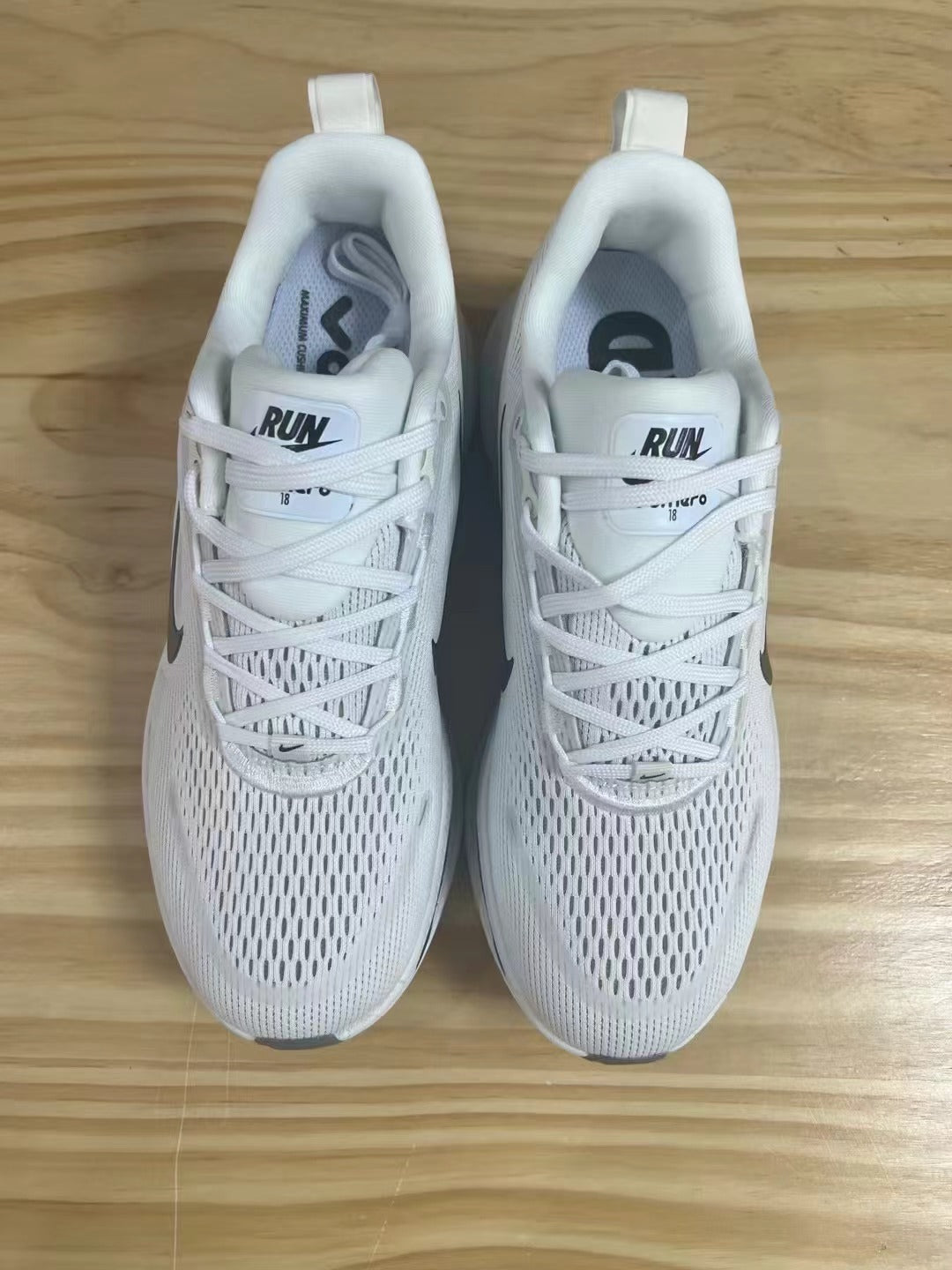 Nike Vomero 18 Shoes for Running, White with Dark Swoosh - product image from the listing.