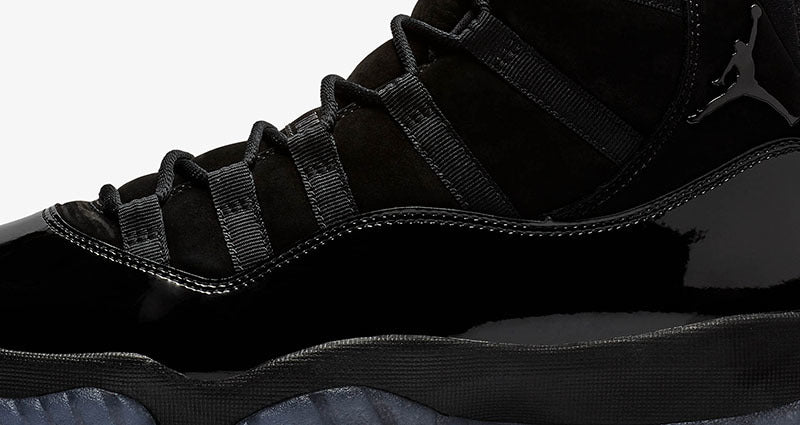 Air Jordan 11 Cap and Gown High-Top Sneakers in Black - product image from the listing.