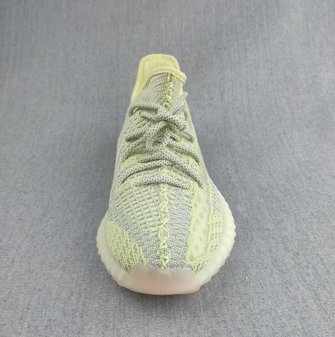 Pale Yellow and Gray Yeezy 350 V2 Knit Sneakers - product image from the listing.
