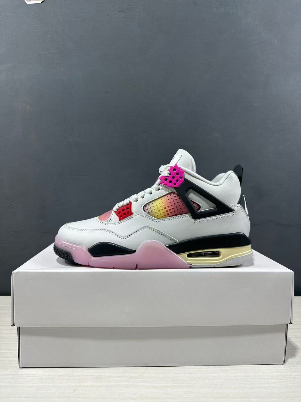 Air Jordan 4 Retro Comic Sneakers White Black Pink JA1135-100 - product image from the listing.