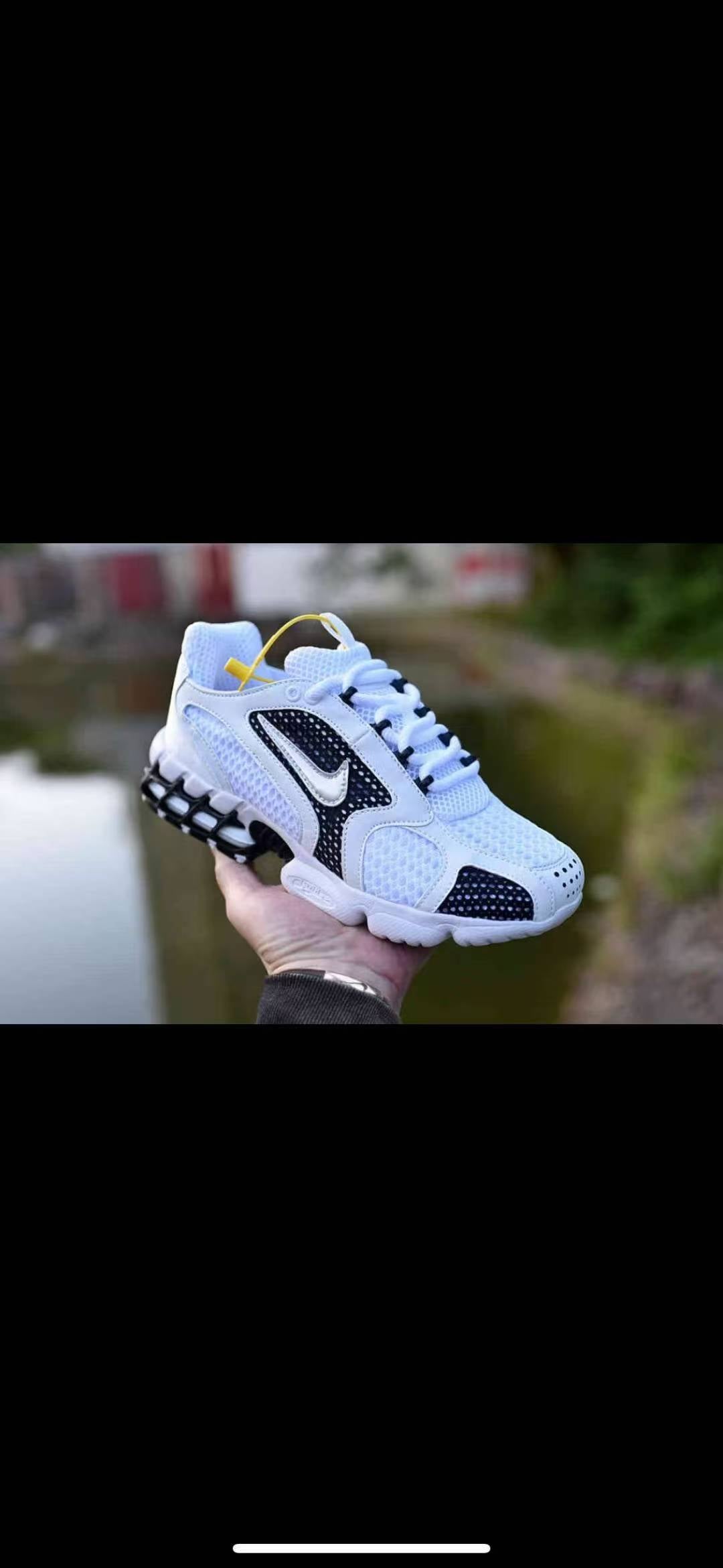 Nike White and Black Running-Style Trainers - product image from the listing.