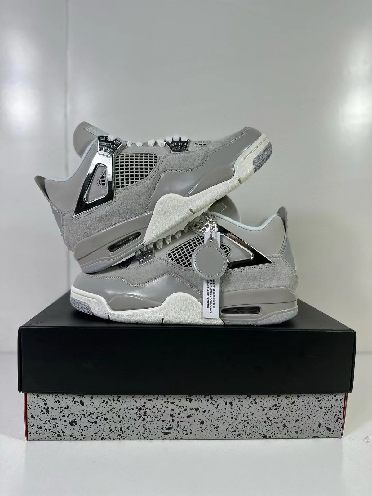 Air Jordan 4 Light Iron Ore Frozen Moments Sneakers - product image from the listing.