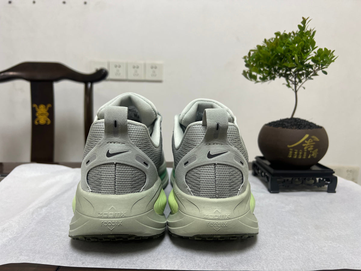 Nike Vomero 18 Running Shoes, in Gray and Volt - product image from the listing.