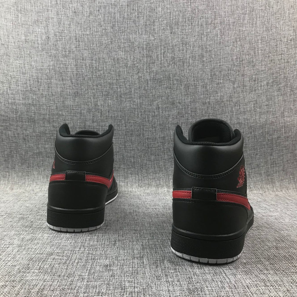 Air Jordan 1 Mid Sneakers in Black and Red 554724-045 - product image from the listing.