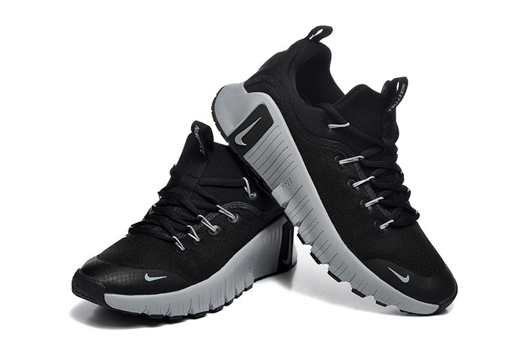 Nike Free Run Low-Top Sneakers in Black and Grey - product image from the listing.